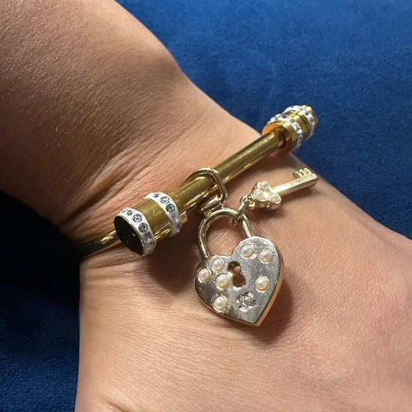 CHANEL heart and lock authentic charm on gold plated bracelet